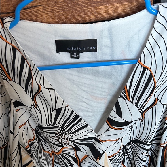 Adelyn Rae Black and Orange Patterned Romper - Picture 4 of 9